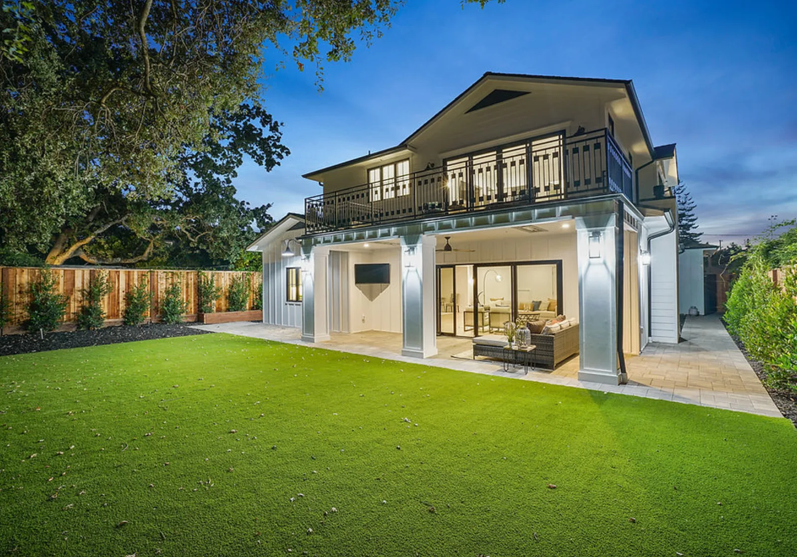 New custom home exterior lit at dusk