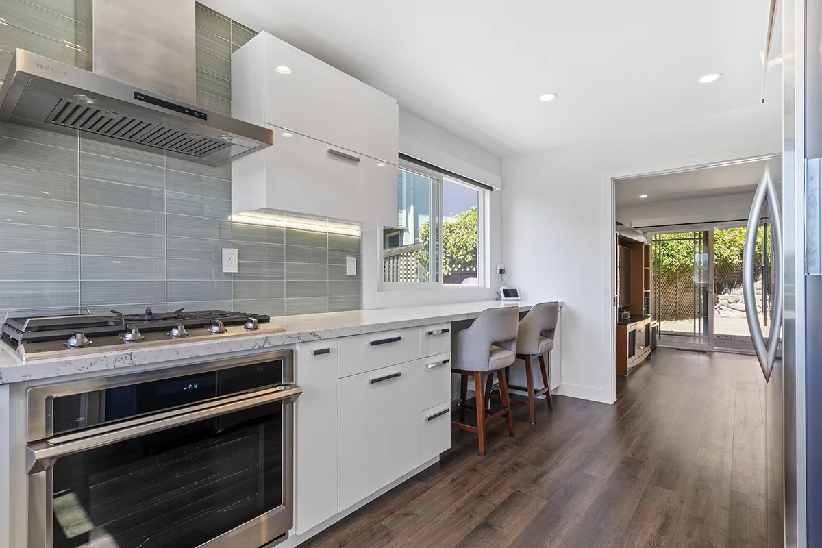 A remodeled Belmont kitchen with white cabinets