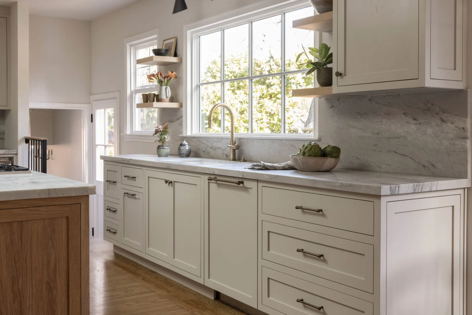 Remodeled Redwood City kitchen with marble counters and oak island